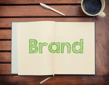 Defter ile metin marka içinde kahve, cep telefonu ve hesap makinesi ile masada