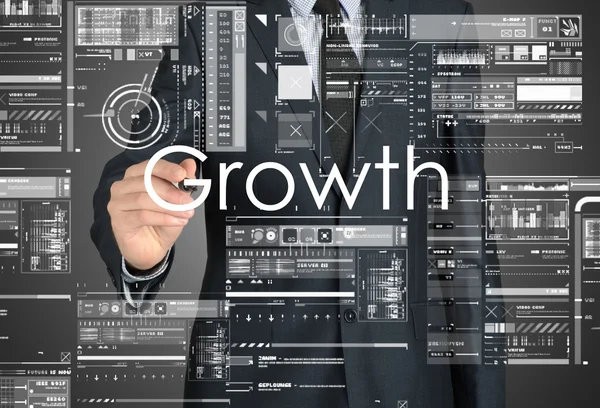 Hombre de negocios escribiendo gráficos y diagramas de crecimiento y dibujo —  Fotos de Stock