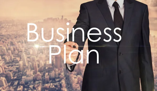 Biznesmen, szkicowanie i pisania biznes planu — Zdjęcie stockowe