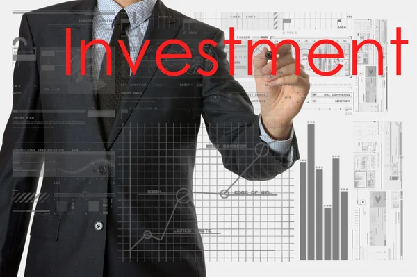 Zakenman schrijven van investeringen en tekenen van grafieken en diagrammen — Stockfoto