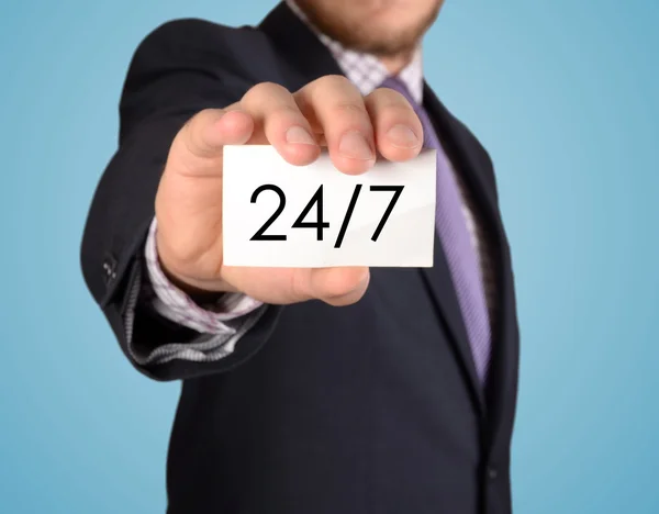 Business man show card with 24/7 support text — Stock Photo, Image