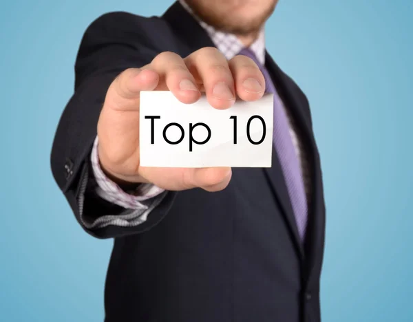 Hombre de negocios mostrar tarjeta con el top 10 de texto —  Fotos de Stock