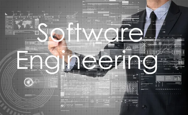 Empresário escrevendo terminologia tecnológica na tela virtual - engenharia de software — Fotografia de Stock