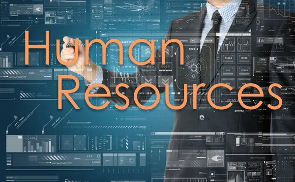 De zakenman is het schrijven van menselijke hulpbronnen op het transparant bord — Stockfoto