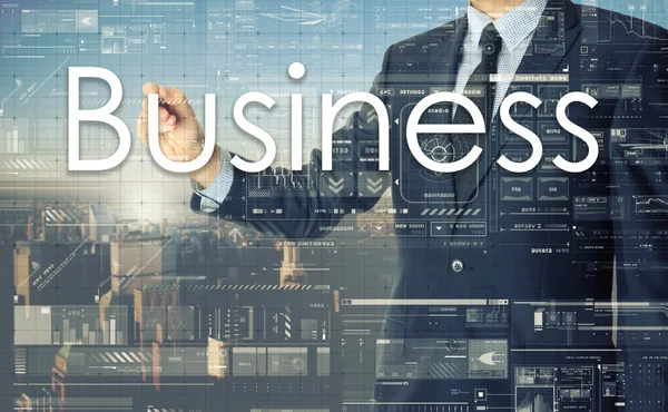 O empresário está escrevendo Negócios no quadro transparente com a cidade em segundo plano — Fotografia de Stock