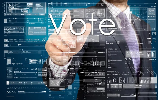 ビジネスマンのタッチ スクリーンのボタンを押すこと: 投票 — ストック写真