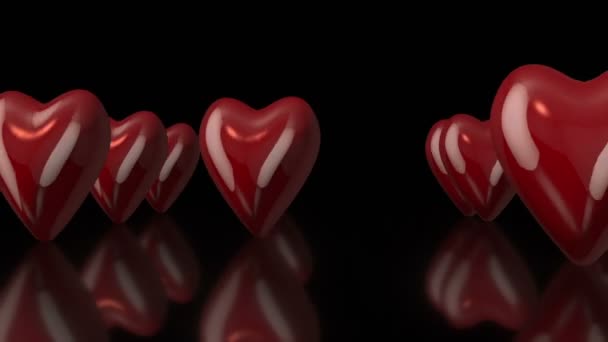3D girando corações de amor em fundo preto — Vídeo de Stock