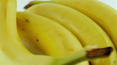 Organik dönen yakın çekim Shot muz - arka plan beyaz