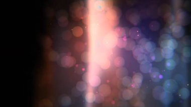 Mavi ve turuncu parçacıklardan oluşan ışıldayan ışınlarla bokeh deseni