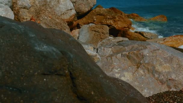 Slider Shot of Mediterranean Volcanic Beach with Black Sand and Red Rocks — Stock Video