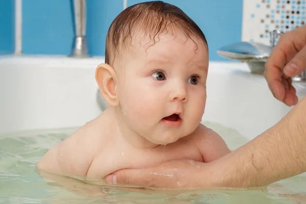 Newborn baby bathe and swim Stock Photo