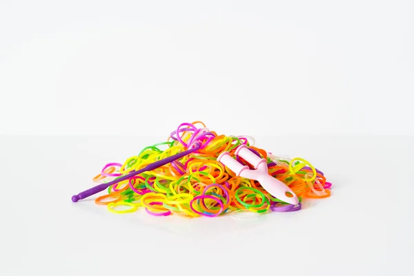 Rainbow loom Colored rubber bands for weaving accessories Stock Photo by  ©photoSIA 91828854