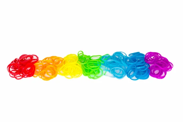 Rainbow loom Colored rubber bands for weaving accessories on a white background — Stock Photo, Image