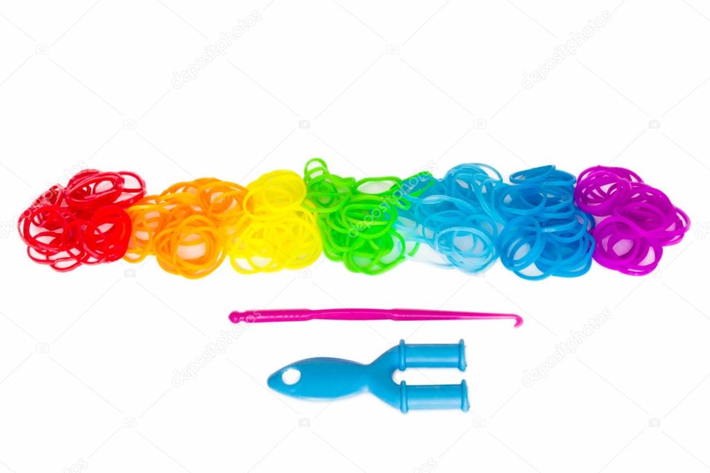 Rainbow loom Colored rubber bands for weaving accessories on a white background
