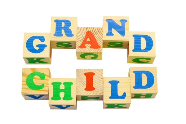 Wood cube with inscription GRANDCHILD — Stock Photo, Image