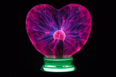 Plasma ball heart glowing in the dark clipart