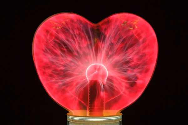 Plasma ball heart glowing in the dark — Stock Photo, Image