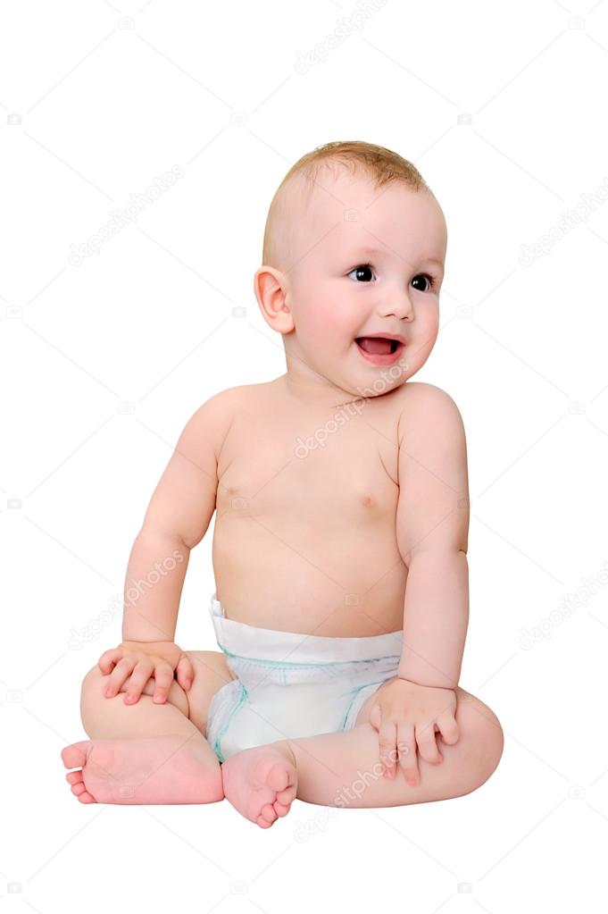 little boy in diaper sits on a white background