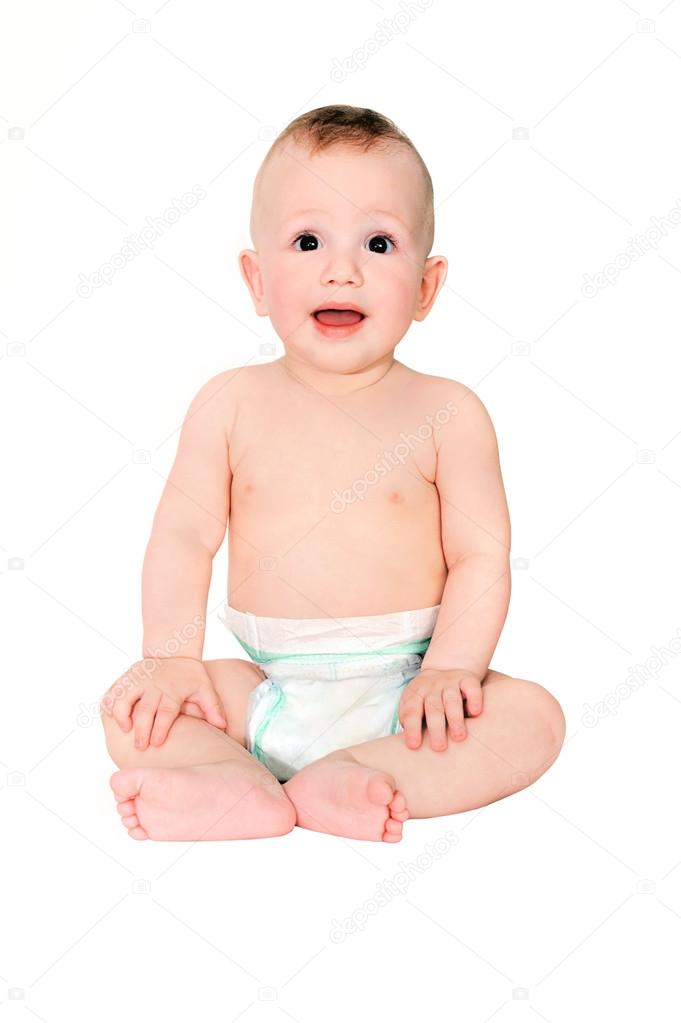 amazed little boy in diaper on a white background