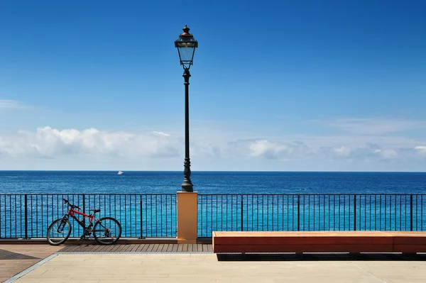 Quay terrace  with bicycle, street light and bench — Stock Photo, Image