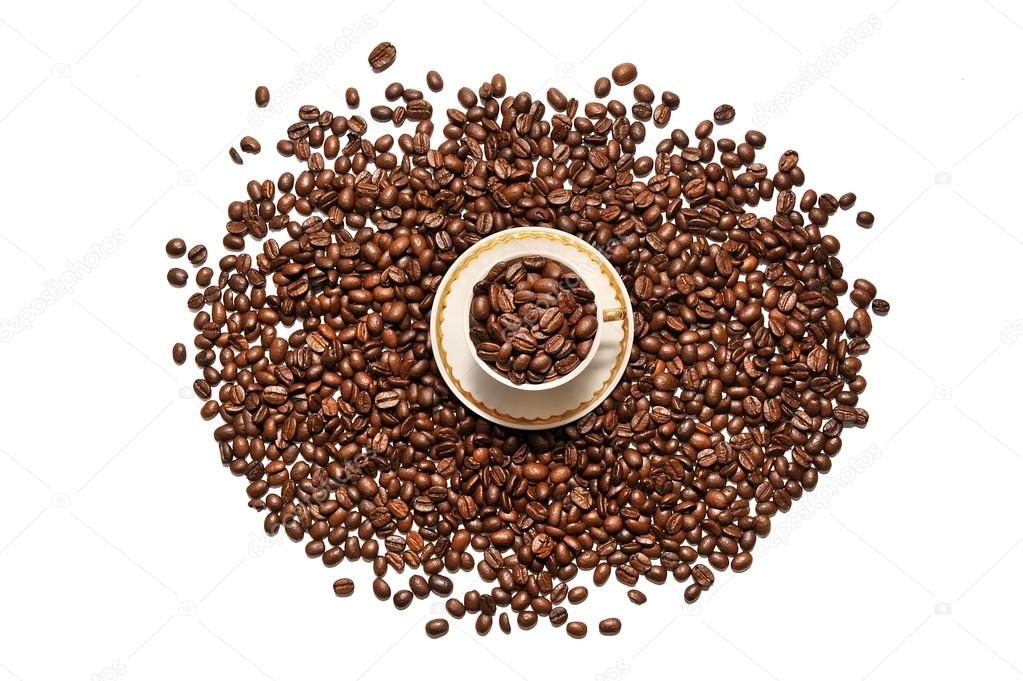  A cup of coffee and grains scattered on a white background