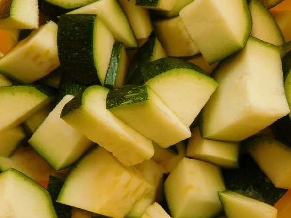 Zucchini to eat in the kitchen on a wooden base — Stock Photo, Image