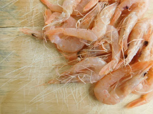 Shrimp feed on wood base — Stock Photo, Image