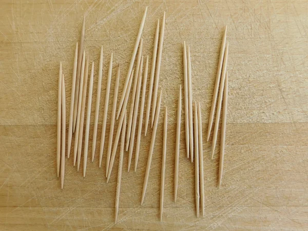 Toothpicks on wood base — Stock Photo, Image