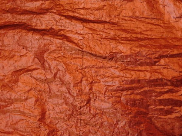 red paper gift wrapping on wooden base