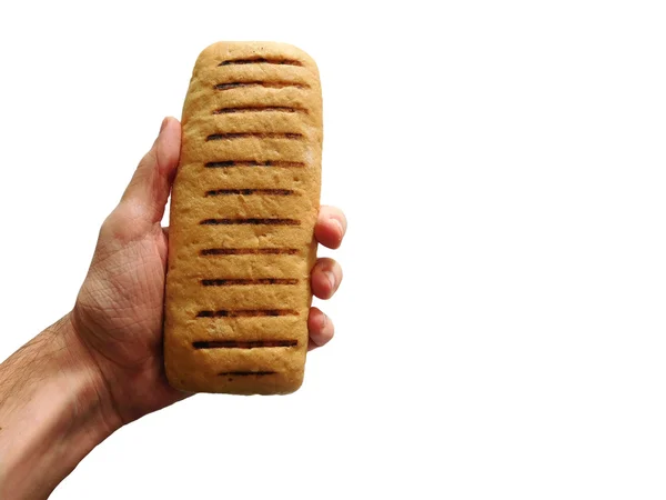 Рука з хлібом на білому тлі — стокове фото
