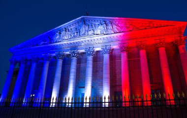 The French National Assembly lit up with the colors of French na clipart