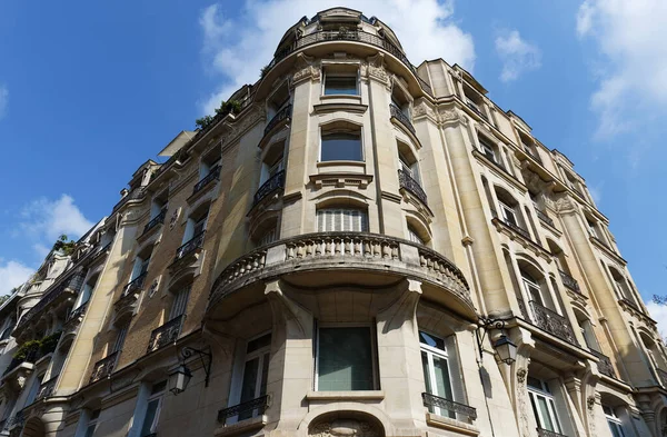 Traditional French house with typical balconies and windows. Paris, France.