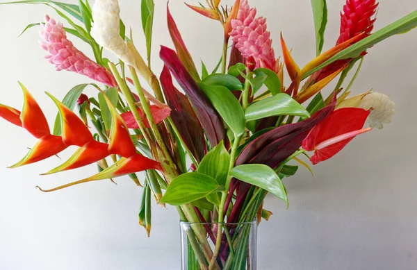 The colorful tropical flowers bouquet arrangement on white background seen in Martinique island, French West Indies.