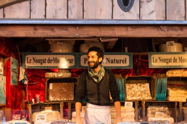 The nougat seller of Christmas market in Paris. clipart