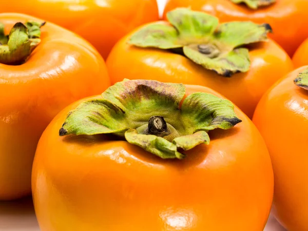 Persimmon di atas putih — Stok Foto