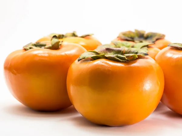 Persimmon di atas putih — Stok Foto