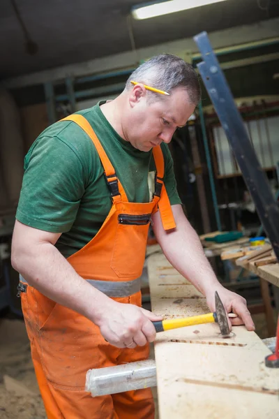 Artisans in woodwork prepares plate for use in making  furniture Stock Photo