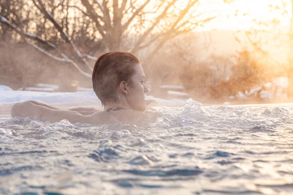 winter pool with a young attractive relaxing woman