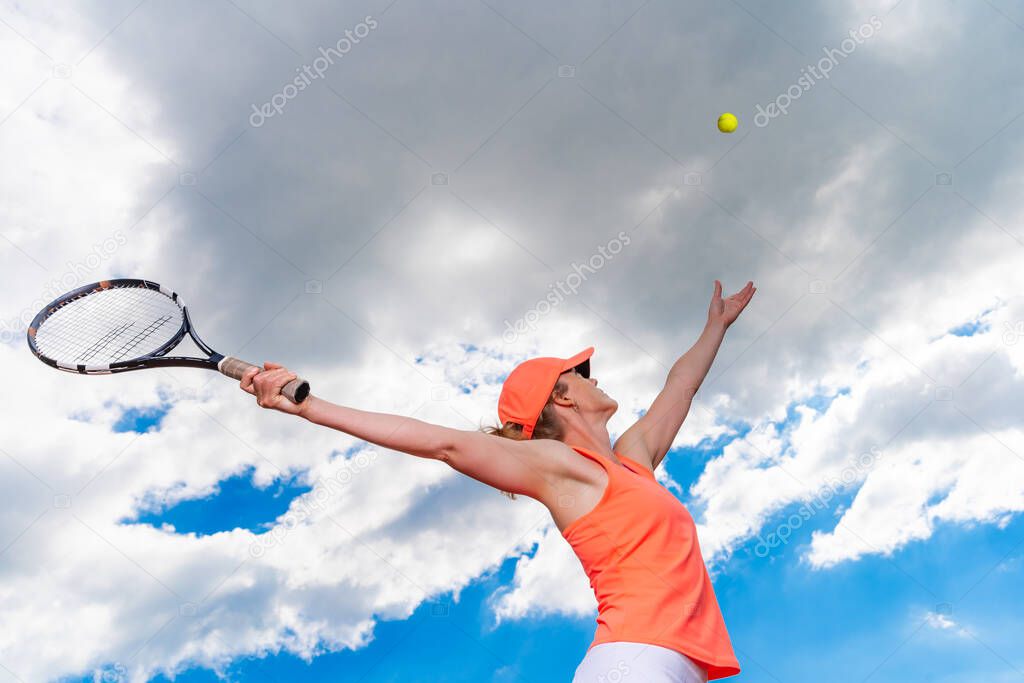 tennis serve by a young woman on the court