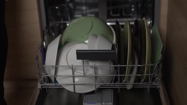 Removal of clean plates after washing from the dishwasher — Stock Video