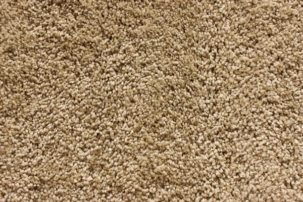 Fragment of material background beige carpet — Stock Photo, Image