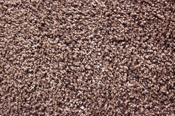 Fragment of material background brown carpet — Stock Photo, Image