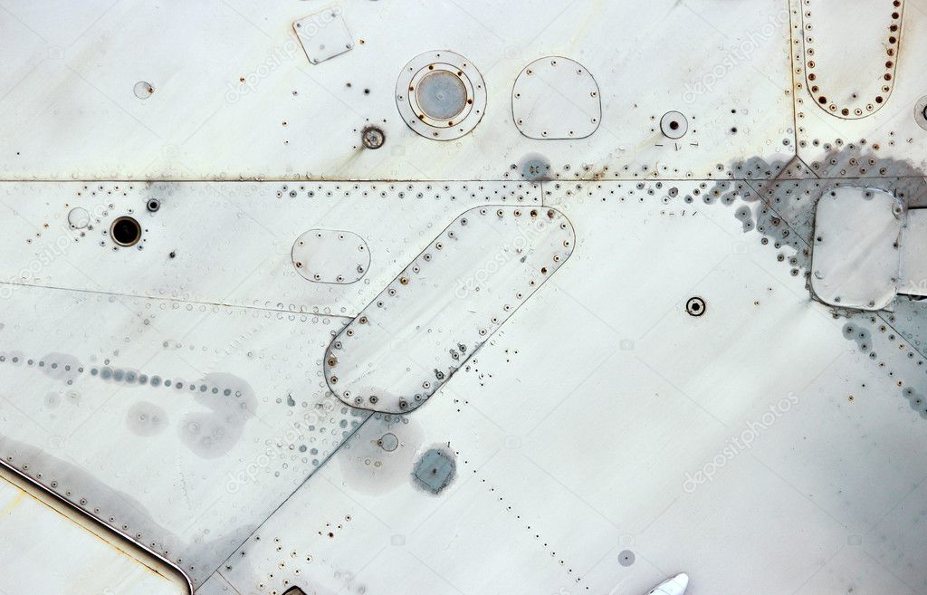 Aircraft metal surface with aluminum and rivets.