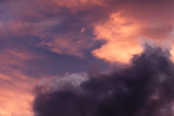 Colorful clouds fragmented in sunset — Stock Photo, Image