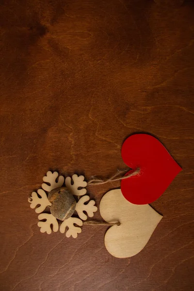 Two Wooden Hearts Snowflake Valentine Day Brown Background — Zdjęcie stockowe