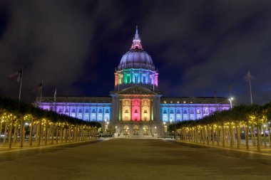 Summer blue foggy skies over San Francisco City Hall lit up in rainbow colors for the 2021 Pride
