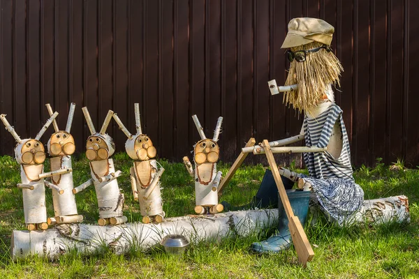 wooden figures depicting characters of Russian fairy tales.Grandfather Mazzei and hares