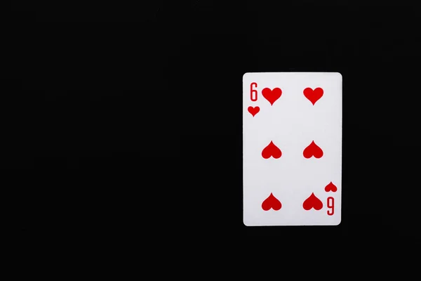 Spelkort. Sex av hjärtan på en svart bakgrund — Stockfoto