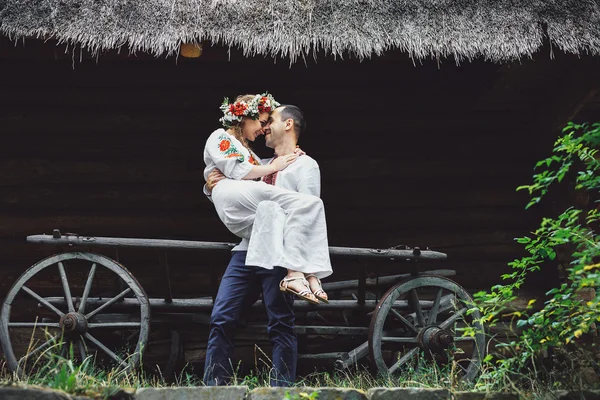 Young Ukrainian couple in traditional clothes — Stock Photo, Image