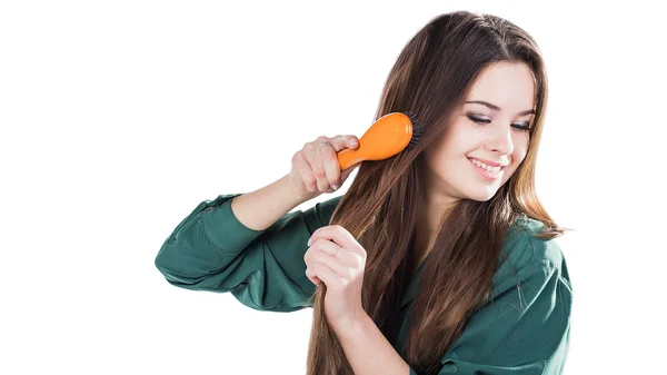 Young girl with hairbrush isolated.smile. — Stock Photo, Image